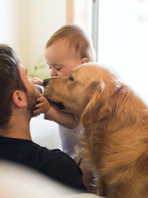 Family having fun with a feeding bottle