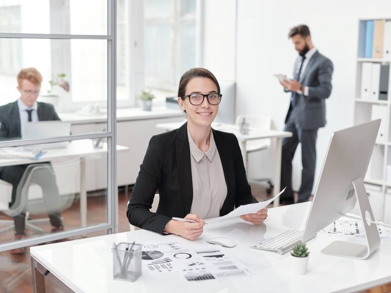 Smiling Business Intern at Workplace